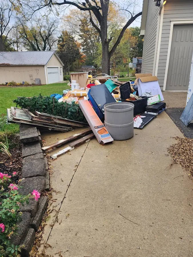 Dumpster being loaded with debris for Roofing Dumpster Rental in Erwin